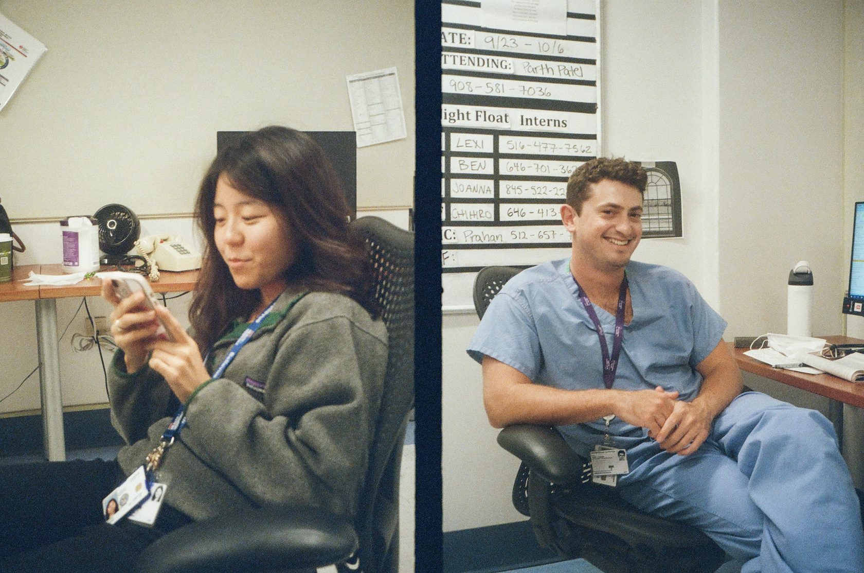 Two colleagues in scrubs at a clinical workstation