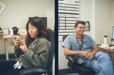 Two colleagues in scrubs at a clinical workstation