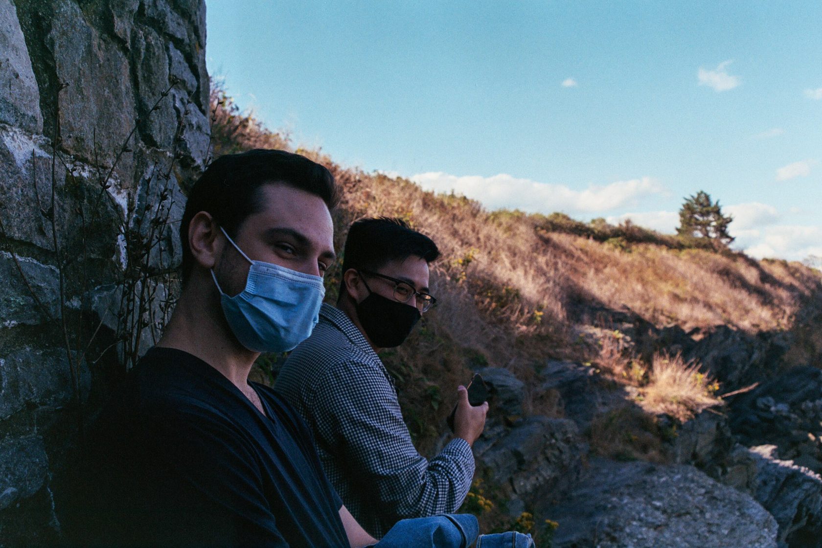 A group pausing on a trail overlooking the water